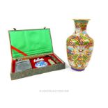 A Chinese cloisonne vase and a calligraphy set