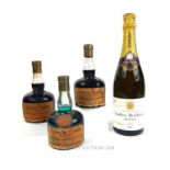 A bottle of 1966 Champagne and three vintage liqueurs