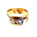 A Gentleman's High Carat Yellow Metal, Diamond and Sapphire ring.