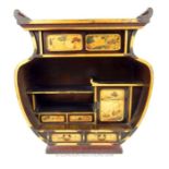 A Japanese Meiji period lacquered tabletop cabinet