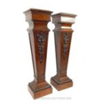 A Pair of Carved Oak Pedestals.