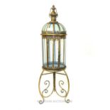 Single large gilt lantern on stand.