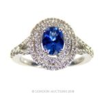 An 18 carat white gold and Tanzanite and Diamond cluster ring.