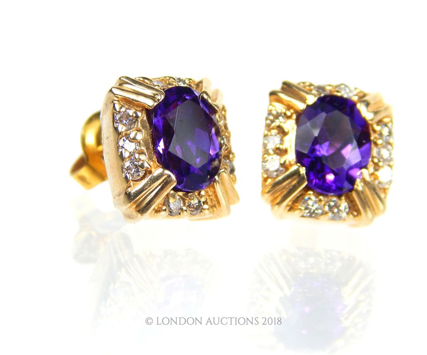 A pair of 14 carat Yellow Gold Amethyst and Diamond earrings. - Image 2 of 2