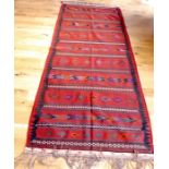 A Persian kelim rug