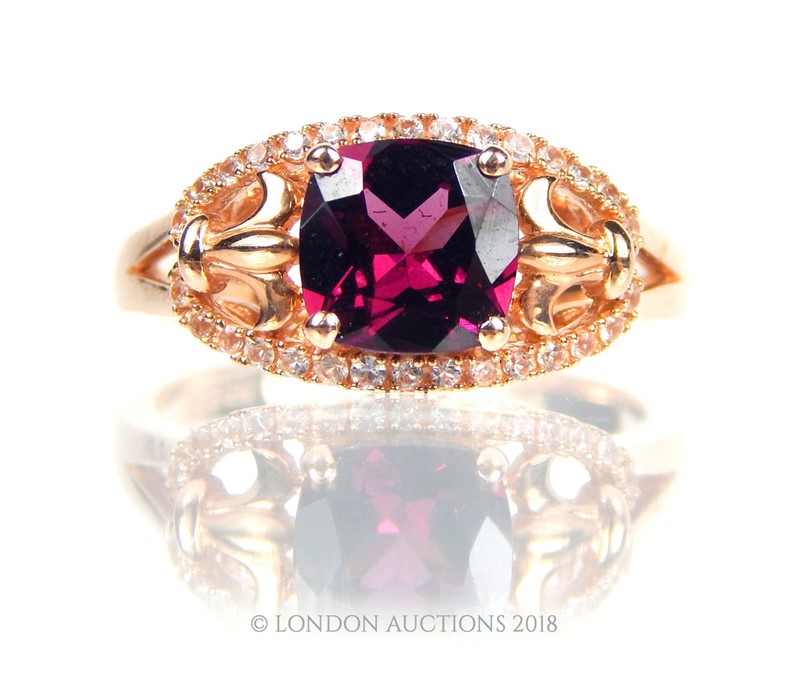 A 14 carat yellow gold Garnet and Diamond ring. - Image 2 of 3