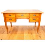 A Continental ash kneehole desk