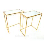 A pair of contemporary mirrored and gilt metal occasional tables