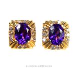 A pair of 14 carat Yellow Gold Amethyst and Diamond earrings.