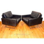 Pair of black leather armchairs by Asko Paelliostys.