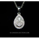 An 18 carat white Gold Diamond pendant necklace on Gold chain.