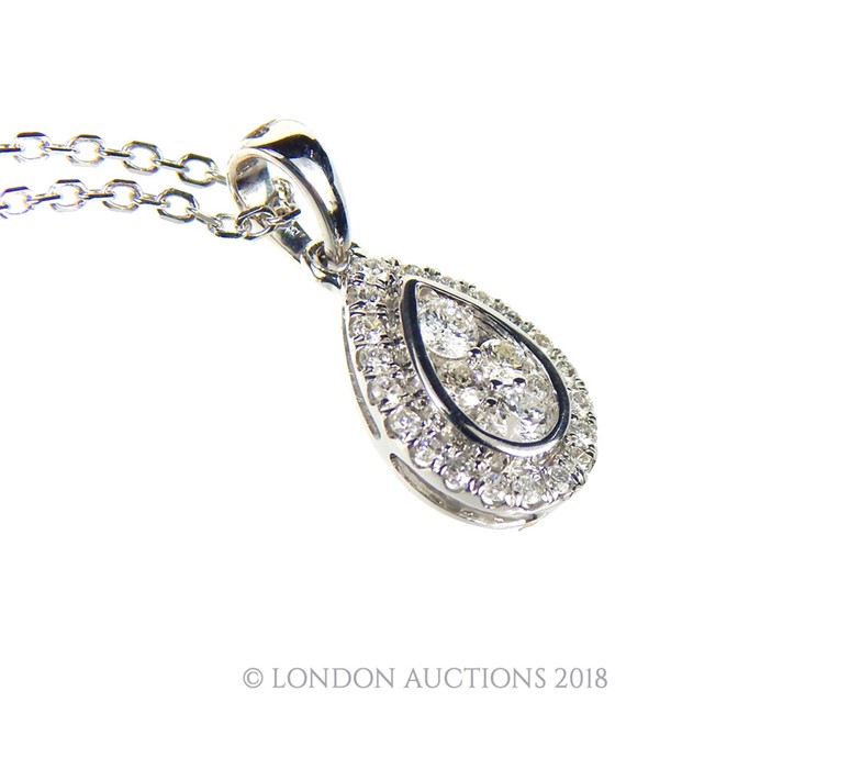 An 18 carat white Gold Diamond pendant necklace on Gold chain. - Image 3 of 3