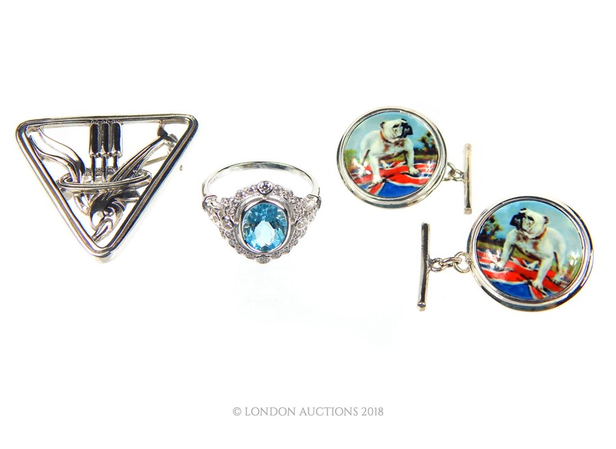 A pair of Silver and enamel cufflinks. a Silver and Aquamarine ring and a George Jensen style brooch