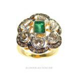 An Emerald and Diamond Ring.