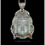 A Silver and rock crystal pendant necklace with ruby cabochons.