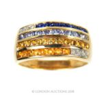 A 14 carat yellow gold Diamond, Citrene and Sapphire banded ring.