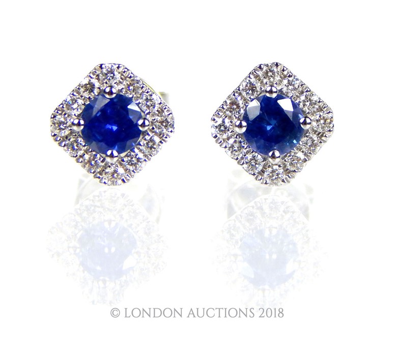 A pair of 18 carat White Gold Sapphire and Diamond earrings.