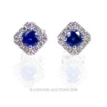 A pair of 18 carat White Gold Sapphire and Diamond earrings.