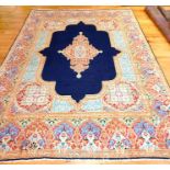 A large Persian Kerman carpet