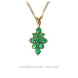 Emerald cluster pendant necklace.