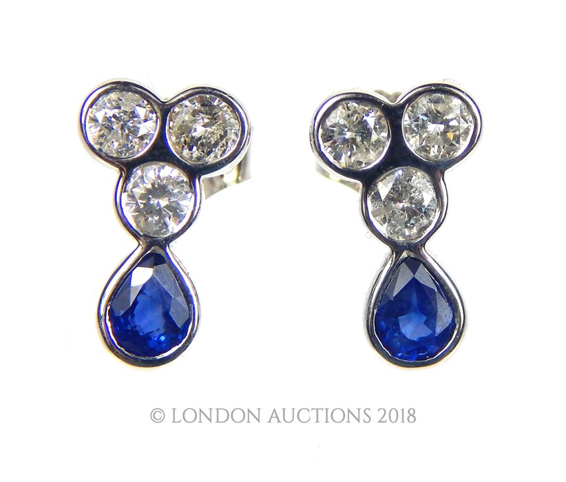 A Pair of Diamond and Sapphire Earrings.