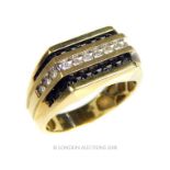 A 10 Carat White and Yellow gold ring Set with twelve brilliant cut White Diamonds between two