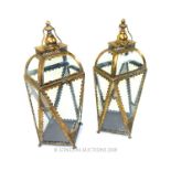 A pair of gilt storm lanterns.