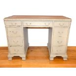 A grey painted and distressed desk.