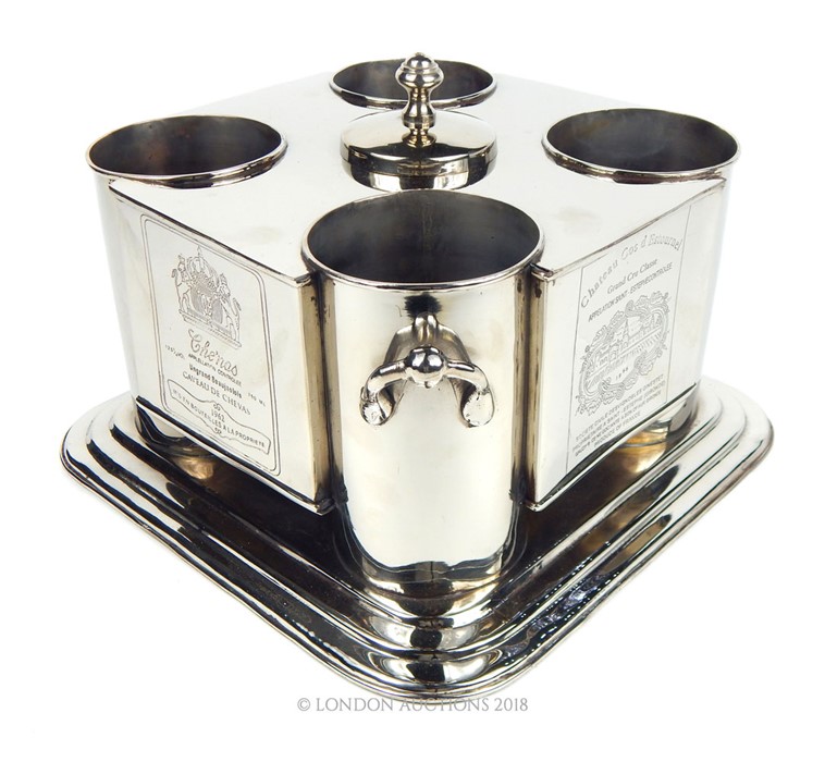 A Four bottle silver plated wine cooler.