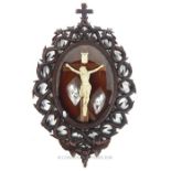 A Black Forest Framed Porcelain of a Crucifix.