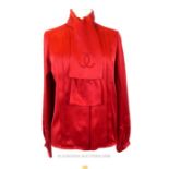 A Chanel Red Silk Blouse.