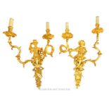 Pair of Louis XV Style ornate Gilt Brass wall lights.