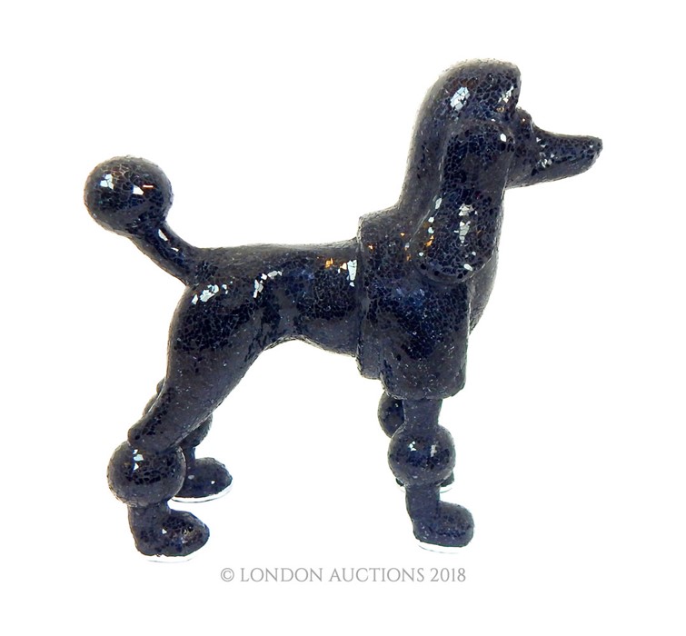 A mosaic sculpture of a French Poodle.