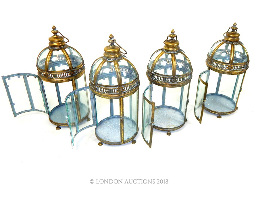 A set of four circular storm lanterns. - Image 2 of 2