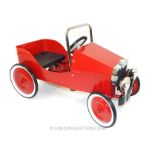 Red Metal Retro classic pedal car.