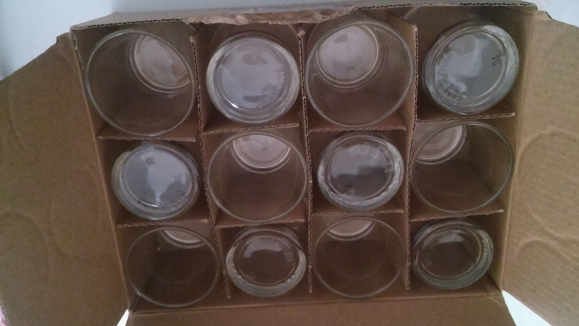 "Eastland" 12 clear glass votive holders.New.