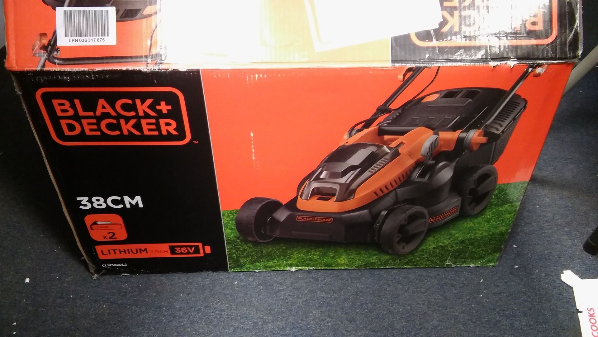 Black and Decker 36v lithium ion cordless lawnmower with a 38cm cutting diameter.Bad packaging