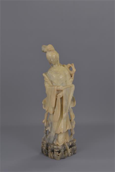 A TALL CHINESE SOAPSTONE CARVING OF GUANYIN