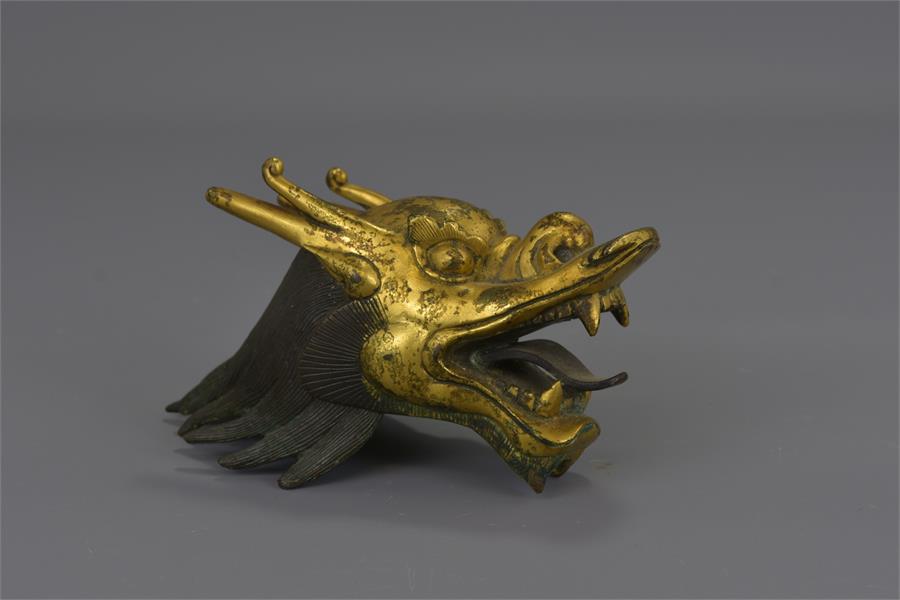 A CHINESE GILDED BRONZE DRAGON HEAD