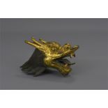 A CHINESE GILDED BRONZE DRAGON HEAD