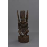 A FAR EASTERN CARVED WOODEN FIGURE