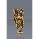 A JAPANESE STAG HORN NETSUKE