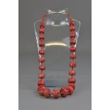 A CORAL BEADED NECKALCE