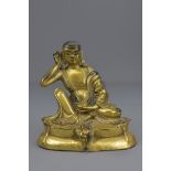 A Tibetan 18/19th century bronze gilded figure. 16cm tall
