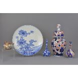 A Japanese 19th century Imari porcelain jar and cover together with four other Japanese items. Jar 3