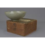 A Korean 14th century or later celadon pottery bowl painted with floral motifs with wooden display b