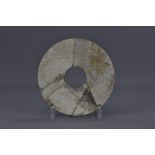 A Chinese Han Dynasty jade disc. 17cm diameter