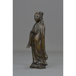 A Chinese 18th century bronze figure of a scholar. 19.5 cm tall.