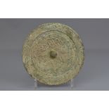 A Chinese Han dynasty bronze mirror with characters. 18cm