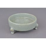 A Chinese 20th century celadon tripod porcelain censer. 12cm diameter